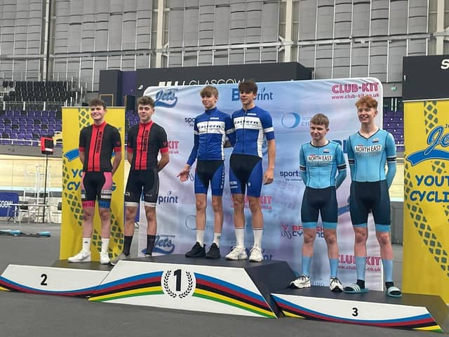 Evander Wishart (left) on top of the podium in Glasgow.
