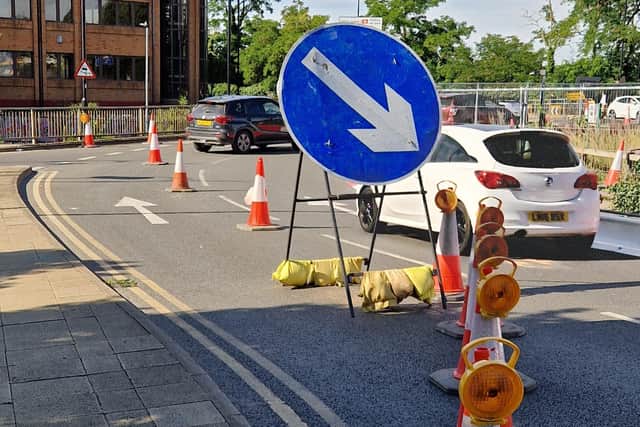 Signage for a lane reduction on the Queensgate roundabout in Peterborough