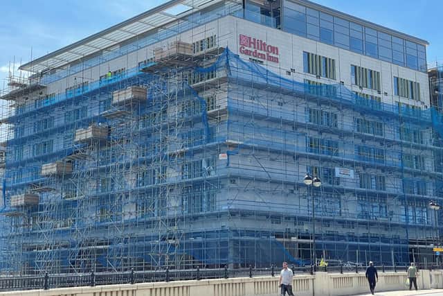 The scaffolding is slowly removed from Peterborough's new Hilton Garden Inn hotel.