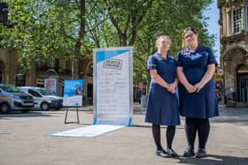 Displayed at Cathedral Arch in Peterborough, the stark 16-ft-long receipt, which overspills its frame and trails along the ground, reveals just how much Sue Ryder’s palliative care and bereavement services cost to run. (Image: Beth Crockatt).