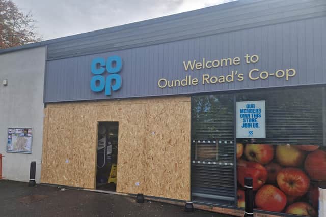 The store is open today - but the front is boarded up