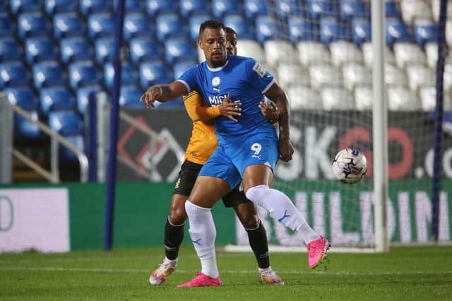 Jonson Clarke-Harris holds the ball against Cambridge United. Photo: Joe Dent.
