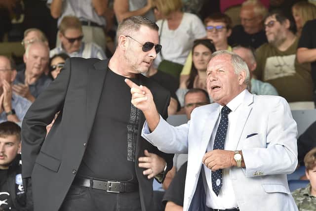 Posh chairman Darragh MacAnthony (left) with director of football Barry Fry.