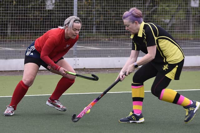 Lynn Sullivan (red) in action for City of Peterborough Ladies 4ths v Haverhill: Photo: David Lowndes.
