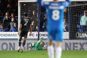 Nicholas Bilokapic of Peterborough United fails to keep out Salford City from scoring their second goal. Photo: Joe Dent.