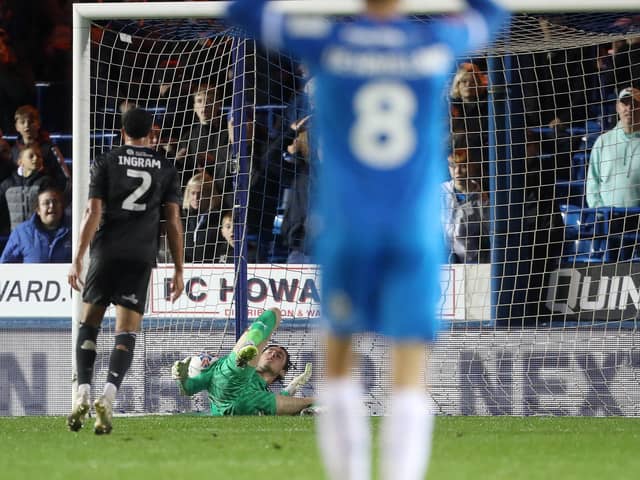 Nicholas Bilokapic of Peterborough United fails to keep out Salford City from scoring their second goal. Photo: Joe Dent.