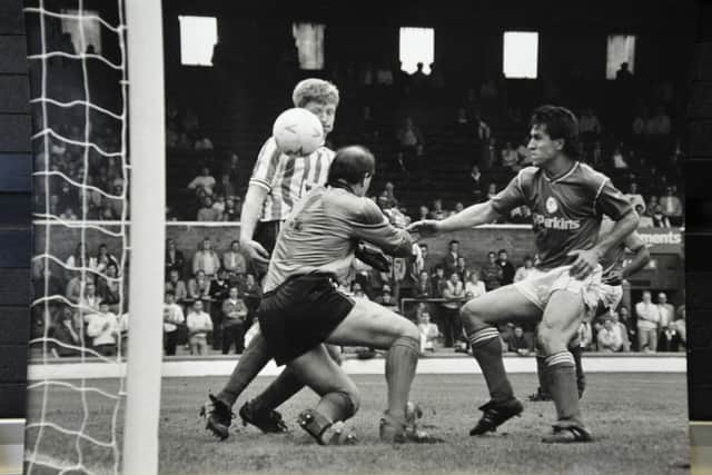 Domenico Genovese (right) in action for Posh., Photo: David Lowndes.