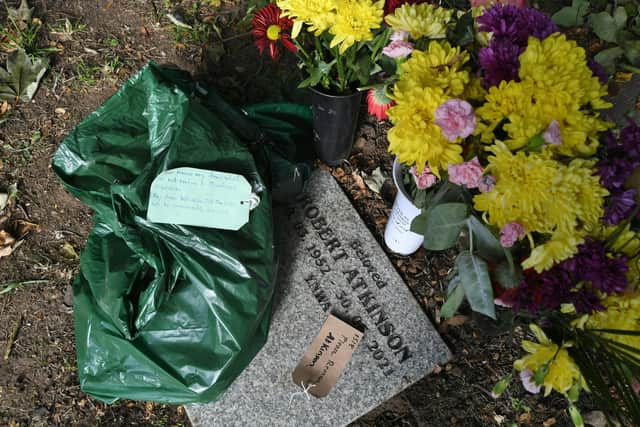 Items have been removed from graves and left in plastic bags at Holy Trinity Church, in Orton Longueville