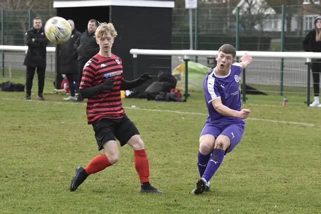 Action from Stanground (purple) v Park Farm Pumas in an under 18 League Cup quarter-final at the weekend. Stanground won 3-1. Photo: David Lowndes.