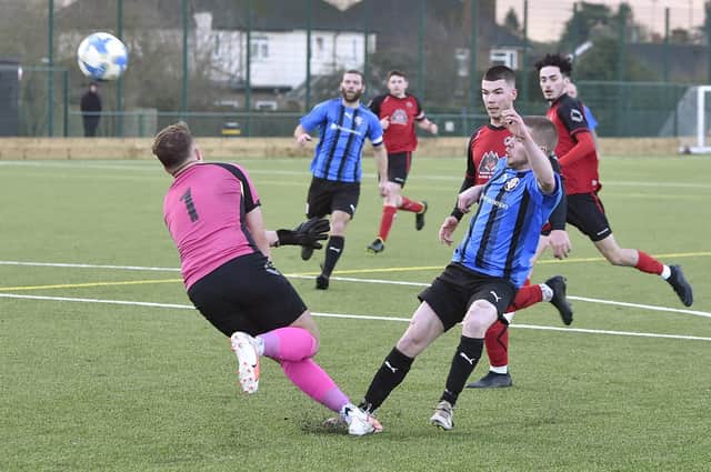 Cardea (blue) in action earlier this season against Netherton. Photo: David Lowndes