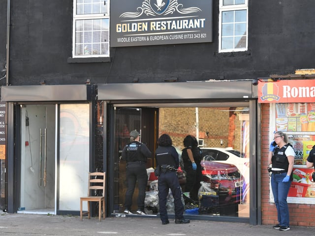 Police and HM Customs officers at one of the raids at Lincoln Road