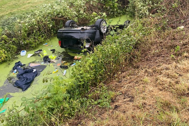 Emergency services rescued five people from this overturned car that came off Ramsey Road, in Farcet, Stanground, on June 5. The passengers rescued from the water-filled ditch include three children.