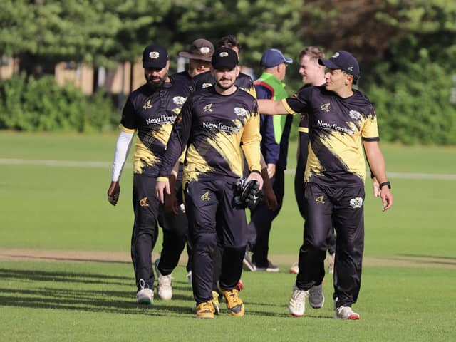 Peterborough Town skipper David Clarke (from, right) leads his side off the pitch after victory against Finedon. Photo Andy Dann.