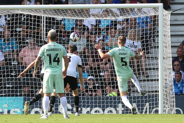 Josh Knight of Peterborough United scores the opening goal of the game against Derby County. Photo: Joe Dent/theposh.com