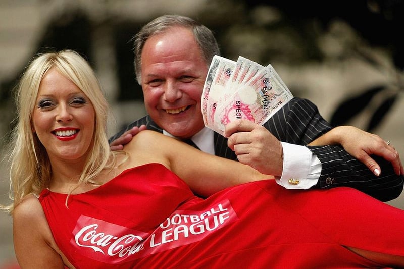 Soccer AM presenter Helen Chamberlain poses for a photograph with Peterborough United manager Barry Fry at Golden Square on July 28, 2004 in London. The event launches Coca-Cola's £1m "Goal Chase" in which 72 league clubs were challenged to score a record number of goals in any one season. (Photo by Bruno Vincent/Getty Images)