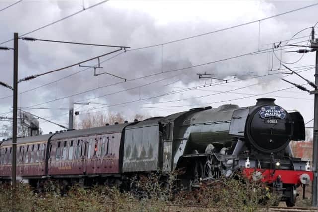 The Flying Scotsman photographed by David Lowndes passing through Peterborough in January 2019.