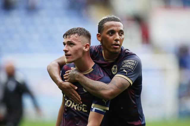Romoney Crichlow celebrated with Harrison Burrows at full-time. Photo: Joe Dent.