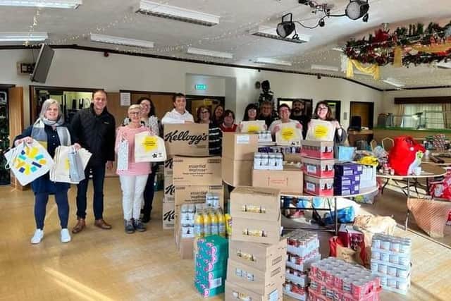 Volunteers packing hampers donated by Waitrose in 2022