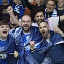 Peterborough United fans watch their play-off semi-final defeat at home to Oxford United.