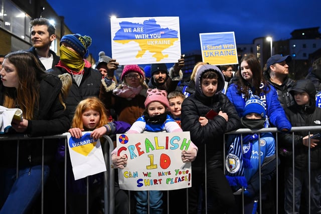 Young fans hold banners to indicate peace and sympathy with Ukraine prior to the Emirates FA Cup Fifth Round match between Peterborough United and Manchester City at ABAX Stadium on March 01, 2022.