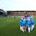 Peterborough United huddle up ahead of kick-off. Photo: Joe Dent.