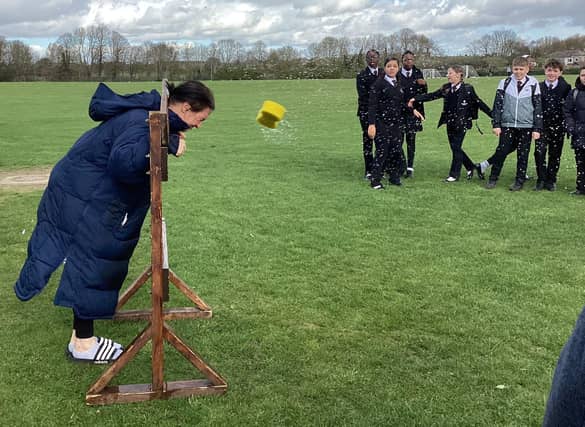 Students participating in 'soak a teacher' during the fundraising activities