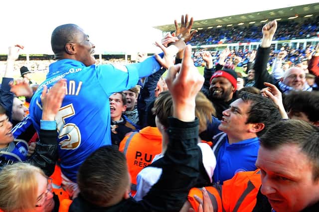 Posh centre-back Gaby Zakuani is carried off by Posh fans after victory in a huge game against Sheffield Wednesday in 2013. Photo: Paul Franks.