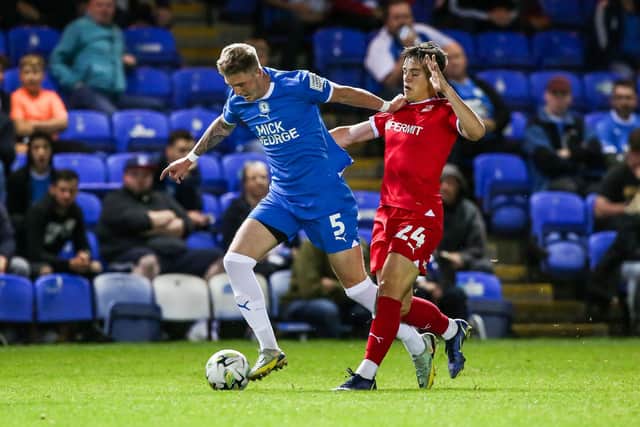 Jacob Wakeling playing for Swindon Town against Peterborough United in the EFL Cup this season. Photo: Joe Dent.