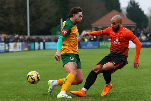 Josh McCammon (orange) almost scored for Peterborough Sports against Alfreton. Photo: Natalie Mayhew