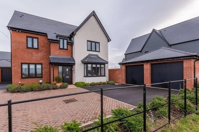The house is set on a prominent plot overlooking Beeby's Lake