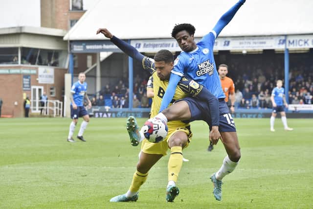 Nathanael Ogbeta battles for the ball against Oxford. Photo: David Lowndes.