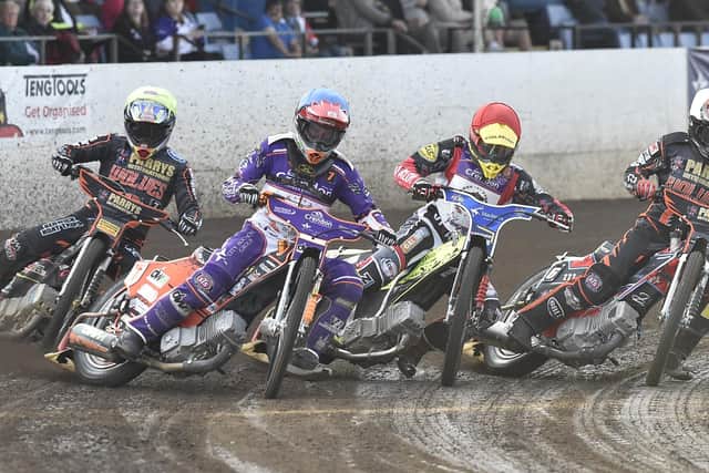 Patryk Wojdylo (red helmet) sets off in his first race in the UK at the East of England Arena. Photo: David Lowndes.
