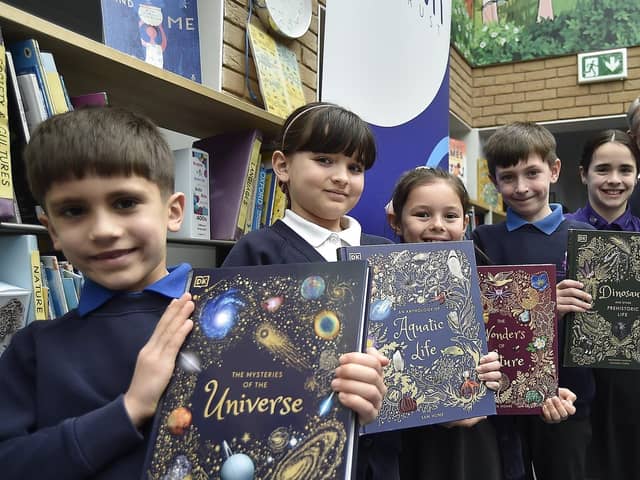 Pupils at Orton Wistow primary school with  Trust CEO Stuart Mansell and Head Teacher Colin Marks at presentation of new books for the library  to celebrate the Trust's 5th anniversary.