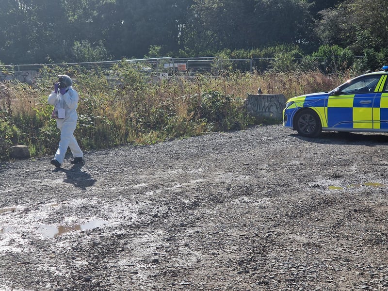 Police officers work at the scene