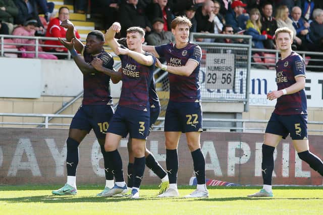Posh celebrate an Ephron Mason-Clark goal at Orient. Photo Joe Dent/theposh.com