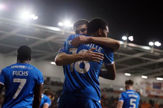 Malik Mothersille celebrates his Posh goal at Blackpool with Ronnie Edwards. Photo Joe Dent/theposh.com
