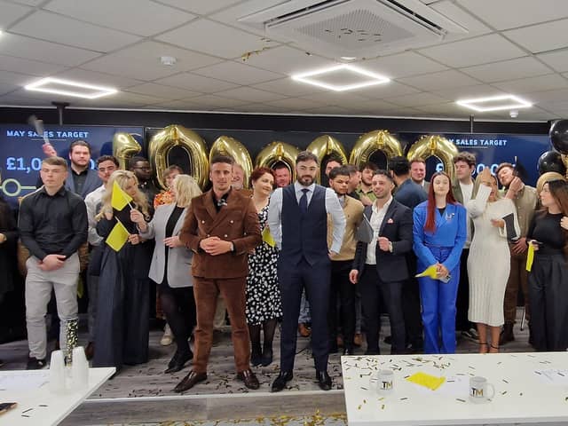 Former BBC The Apprentice Joseph Valente, centre, with staff at Trade Mastermind in Peterborough celebrating a first £1 million sales month