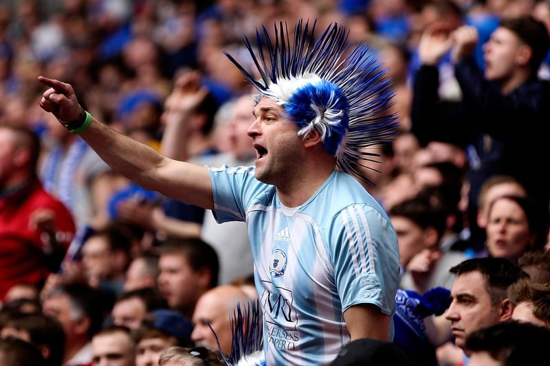 A Peterborough fan cheers on his team during the Johnstone's Paint Trophy Final win over Chesterfield.