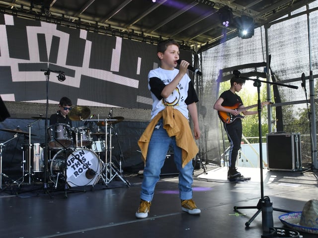 Upon this Rock band perform on stage.