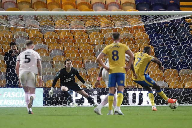 Lukas Akins converts a last-gasp penalty for Mansfield to take their Carabao Cup tie against Posh to a shootout. Photo: Joe Dent/theposh.com.