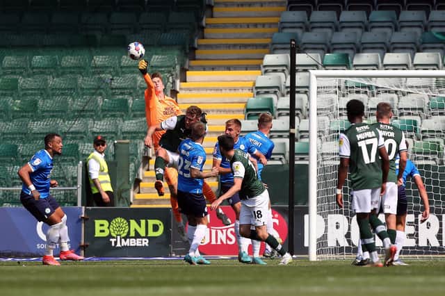 Lucas Bergstrom of Peterborough United punches the ball clear against Plymouth Argyle. Photo: Joe Dent/theposh.com