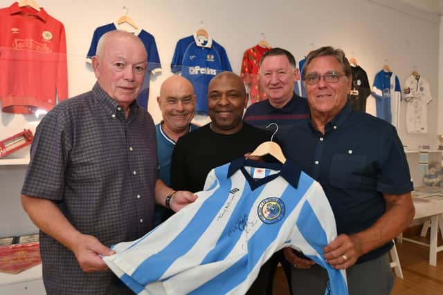 Launch of the Tommy Robson statue appeal at Peterborough Museum. Former Posh players John Cozens, David Gregory and Trevor Quow with (back) Posh fan Adi Mowles and former Posh director Bob Symns with Tommy's shirt.
