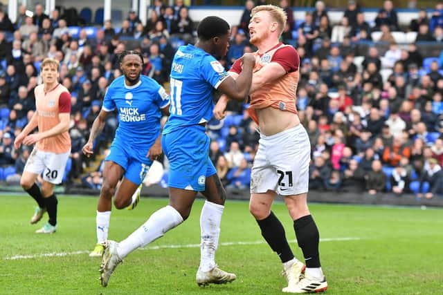 Kwame Poku and Jack Sparkes get into an altercation. Photo: Joe Dent.