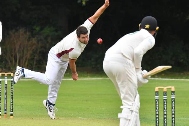 Josh Fisher bowling for March Town against Castor. Photo David Lowndes.
