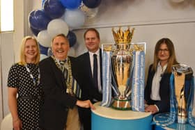 Mayor Cllr Alan Dowson at the Barclays Community site at the ICA Centre, Fletton, with Lorna Humphrey, the site lead, Craig Ward, customer care manager and Rasa Pienaar the Barclays Church Street branch manager and the Premiership Trophy.