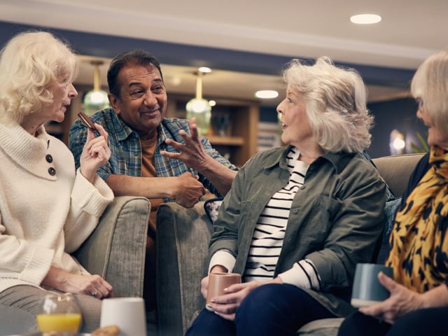 A representation of future homeowners at the site enjoying the communal living area.