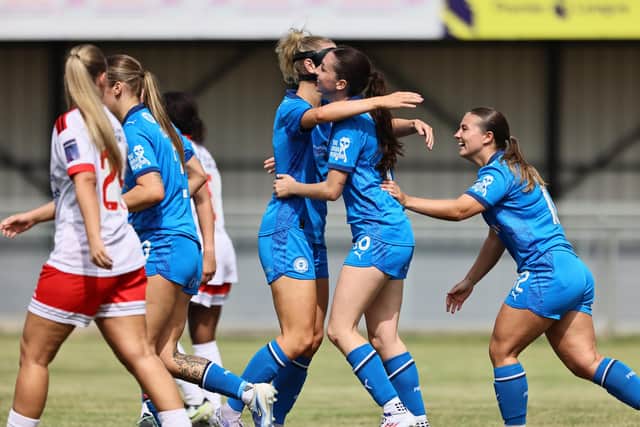 Posh Women celebrate a goal from Anna Pitt (second right) against Lincoln United. Photo Darren Wiles