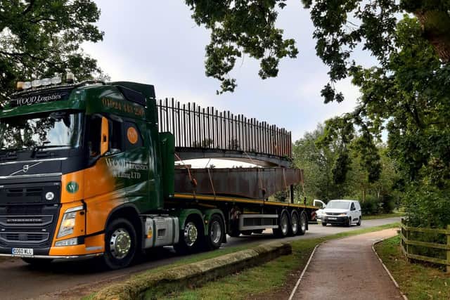The new bridge - which has been designed and constructed in Cumbria - is being transported to Ferry Meadows in sections by lorry.