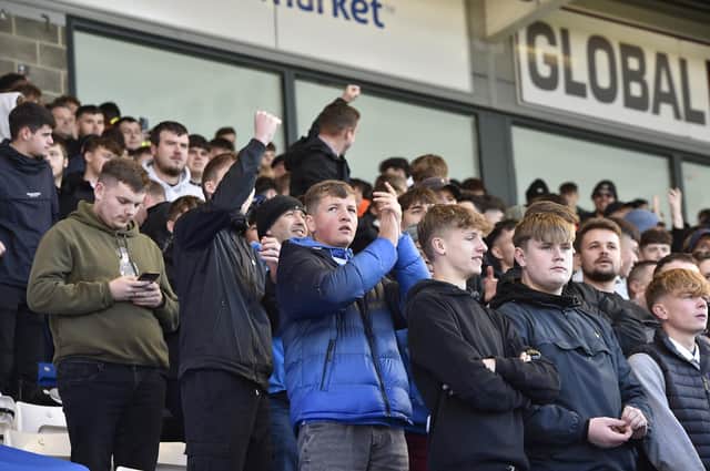 Posh fans bringing the noise in the Deskgo stand. Photo: David Lowndes.