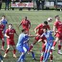 Stamford AFC (red) in action. Photo: David Lowndes.